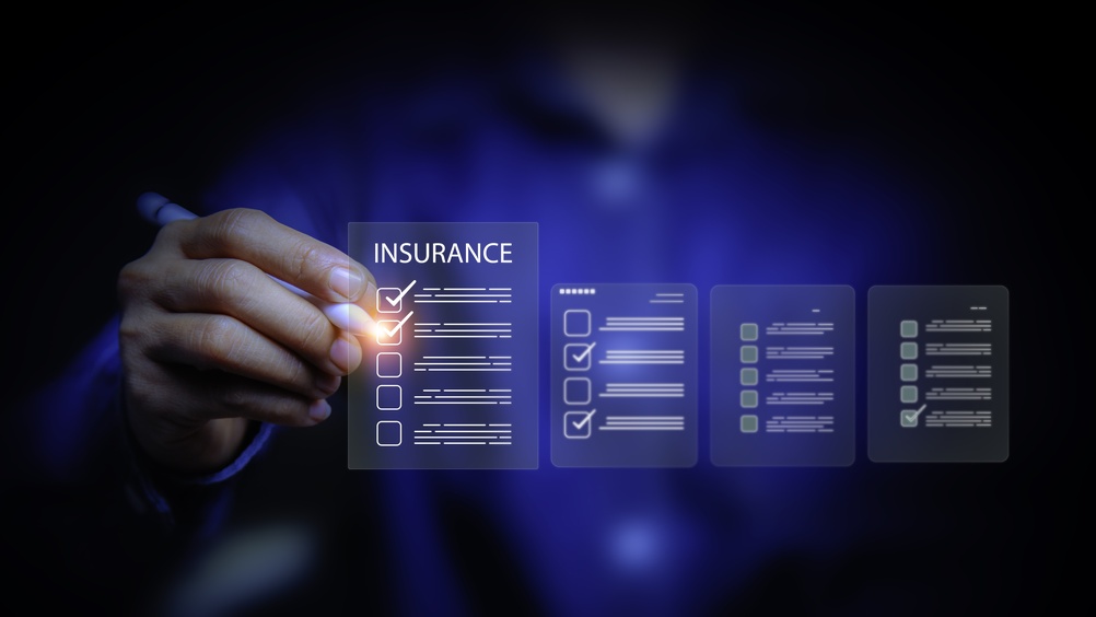 Insurance professional reviewing digital insurance coverage options and policy updates.