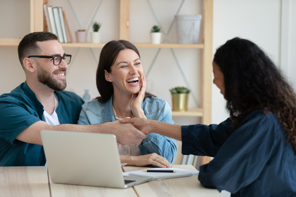Independent Insurance Agent in the Southwest greeting clients during an insurance consultation