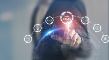 A finger hovers over a button that says data driven, concept of modern insurance agency business.