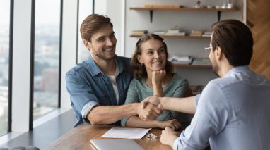 Independent insurance agent onboards new clients in his office.