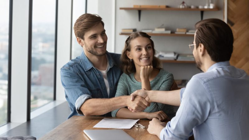 Independent insurance agent onboards new clients in his office.