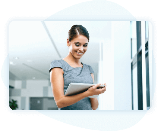 Smiling woman in an office setting taking notes