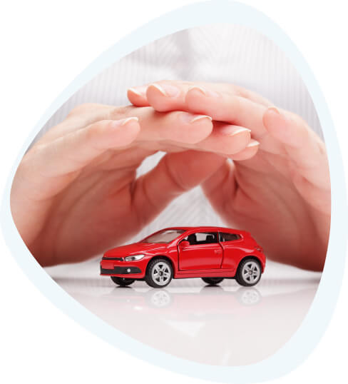 Two hands making a shelter over a toy car.