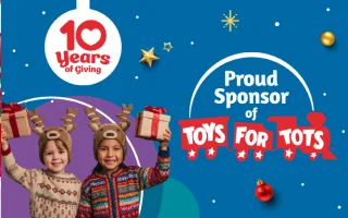 Child holding toys, festive background.